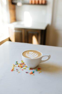 The Breakfast in Bed: a nostalgic latte made with fruity pebble infused milk.