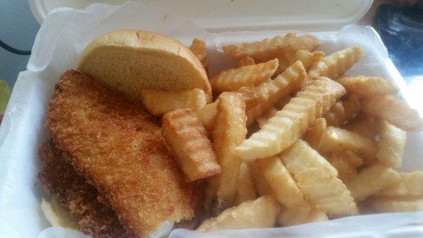 Deluxe fried flounder that comes with fries.