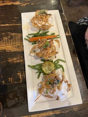 Chicken Fried Steak resting on creamy mashed potatoes, the spin on this is the fried onions on top!