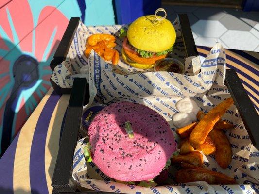 Pink bun is flower burger and yellow bun is spicy chickpea burger !! Yum yum yum!