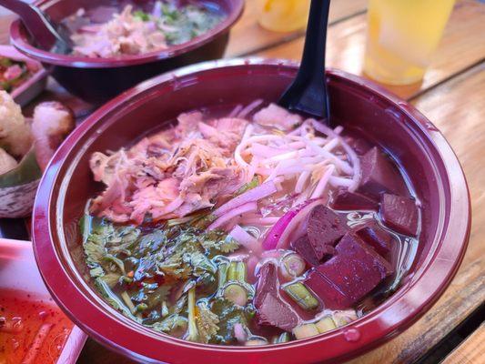 Udon noodle soup with chicken and pig blood cubes