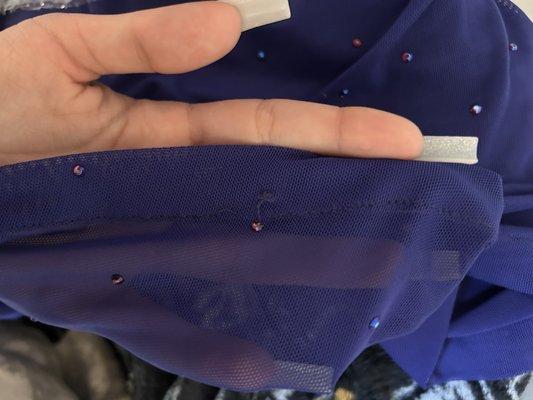 SHE DOESNT KNOW HOW TO SEW!!! there's literally a hole at the bottom of my dress