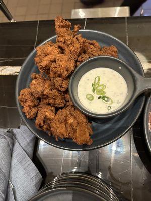 CRISPY CHICKEN BITES With buffalo spiced, ranch dip