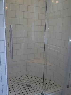 This is the shower built in the upstairs master suite conversion. It features black and white tile with a custom all glass sh...