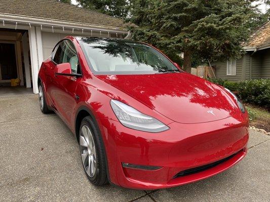 Brand new Tesla Model Y in a beautiful Ferrari red