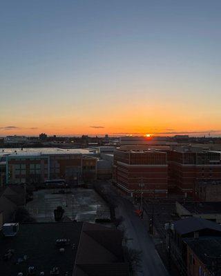 View of sunrise from rooftop conference room.