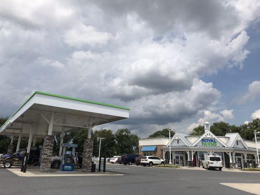 First line of gas pumps and storefront.