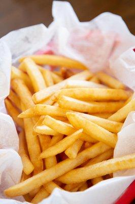 crispy golden delicious fries out out the fryer