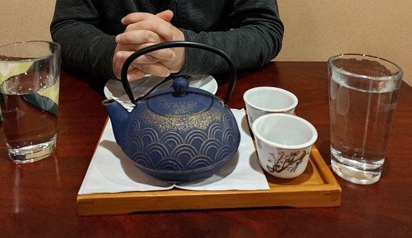 Oolong tea in a beautiful teapot with tea cups