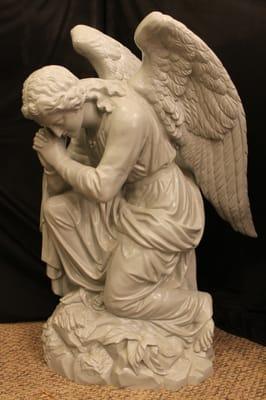 We also restore monuments, statues and funerary sculpture.  This zinc angel was cleaned, patched, welded and powder-coated.