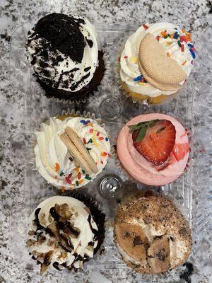 Left: Turtle Cupcake, Birthday Cake Cupcake and Oreo Cupcake  Right: Cookie Dough Cupcake, Strawberry Cupcake and Birthday Cake