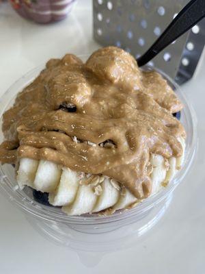 Regular açaí bowl with peanut butter drizzle