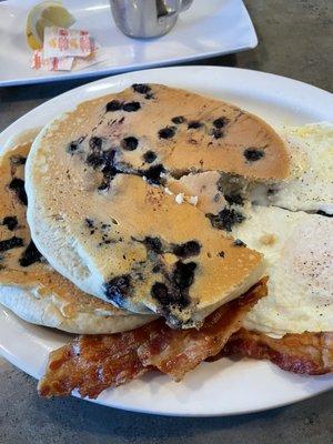 Blueberry pancakes with eggs and