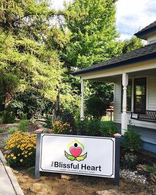 Blissful Heart sign in front of building