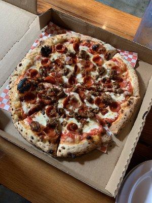 "Dad's favorite" pizza with sausage, bacon and pepperoni.