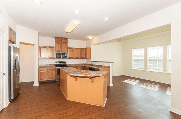 Open concept kitchen, dining and family rooms.