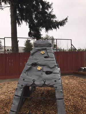 Rock climbing wall on the pre-k playground. My niece loves climbing it.