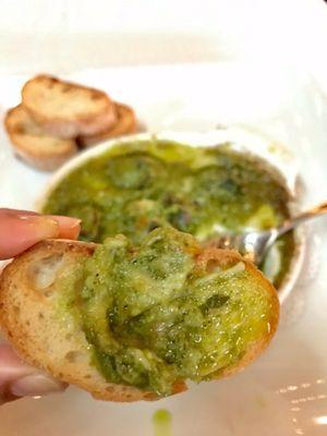 Classic Escargot with tarragon scampi butter, melted Parmesan reggiano and toasted baguette