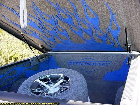 This is the bed of my truck that they carpeted with suede and marine grade carpeting.  They even built the spare tire holder.