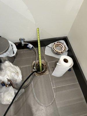 Toilet removed during isolation test to locate leak.