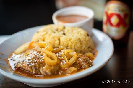 Stewed cube steak with onions.  Served with Spanish rice and beans.