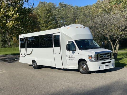 White Party Bus. Holds 18 passengers, 17 comfortable