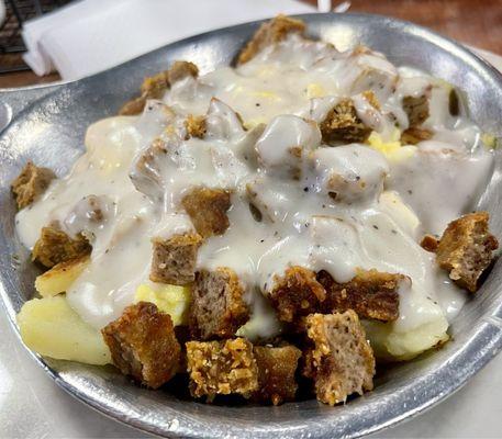 Country Skillet- Chicken Fried Steak, Scrambled Eggs, and Home Fries topped with Gravy.