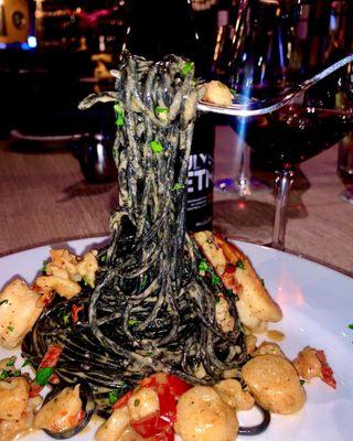 Squid Ink past with scallops, shrimp and lobster in a lemon butter sauce