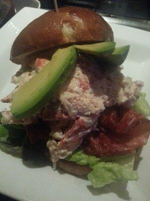 LOBSTER ROLL "CLUB" prosciutto, avocado, tomato conft & spiced mayonnaise on lettuce, served on a brioche