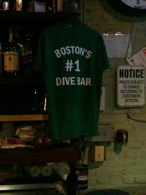 The shirt that hangs behind the bar.