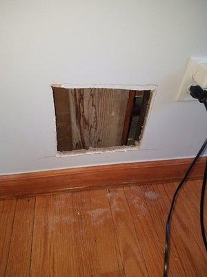 hole on the first floor wall ( above garage)