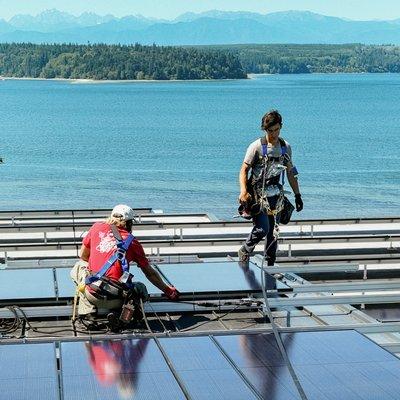 Installing solar PV near Puget Sound.