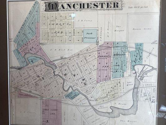 The décor includes an antique map of Manchester