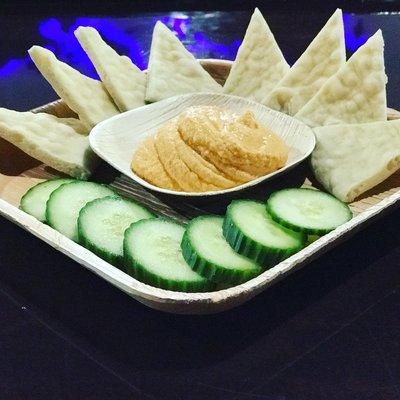 The hummus plate with warm pita and fresh cucumber is delicious!