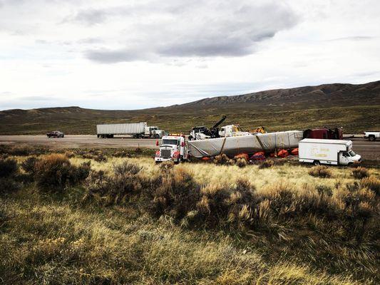 Our heavy duty wreckers recovering a wrecked semi truck.