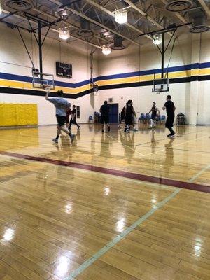 Men playing basketball.