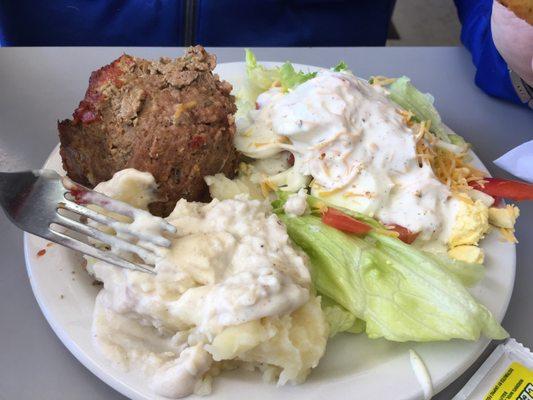 Friendly, local cooking, Delicious Meatloaf from buffet and Peach Cobbler.