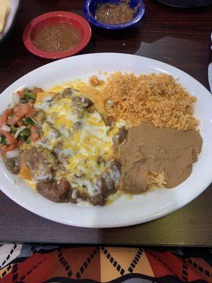 Mad Carne Guisada Enchilada., so great. The beef tips on top actually melted in my mouth