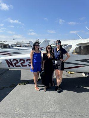 In front of plane with my instructor Lindsay and my friend