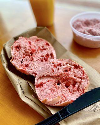 Strawberry bagel with strawberry cream cheese & fresh-squeezed oj