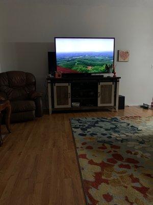 Love our new TV Cabinet. Barn door style has storage in the center section and areas for the chords to come through.