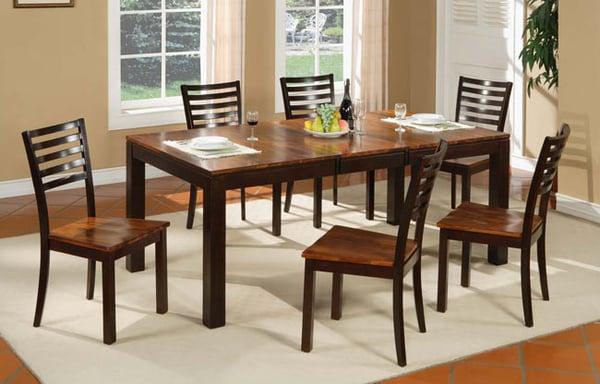 This acacia wood dining room set if just one of many in our warehouse showroom.