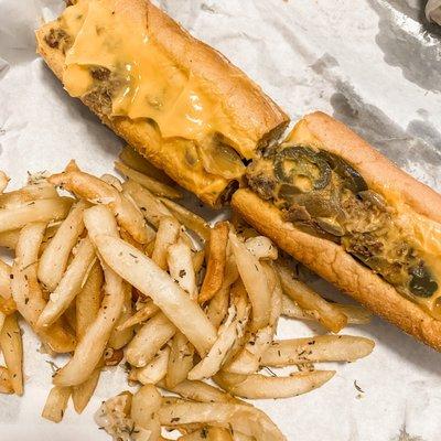 Beef Phillie with mushrooms, jalapeños, bell peppers, spicy whiz and garlic parm fries