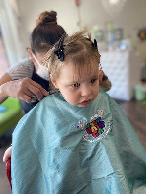 Baby girl getting haircut