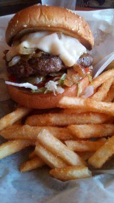 Farley's Mesilla Mex Burger with fries. A big half pound burger, a bit dry, not juicy, and lacking seasoning. Rate it a "B" or "B+."