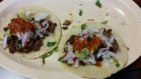 Grilled beef tacos.  Awesome homemade tortilla