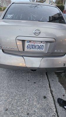 My car with a huge hole in the bumper made by the towing company. Only one day for them to make a humongous hole in my bumper.