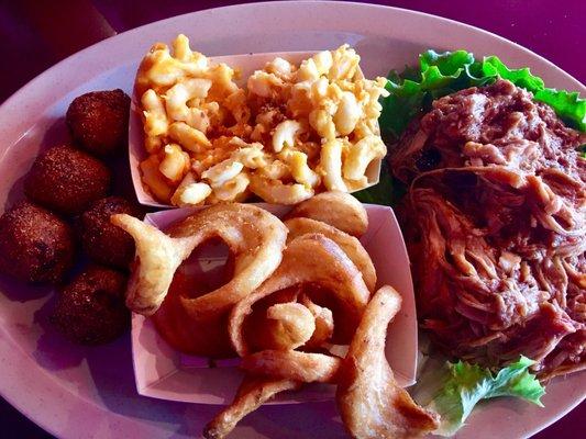 Pulled pork platter. 2 sides: fries + mac and cheese. Also comes with hush puppies.