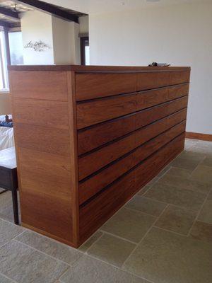 Teak dresser, 24"x60"x120" with 18 full extension drawers.