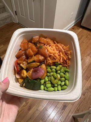 Build your own poke bowl with sushi rice, Salmon poke, edamame, roasted veggies, pickled carrots, and teriyaki sauce